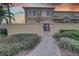 Townhouse exterior with landscaped walkway and gated entry at 2888 Bella Vista Dr, Davenport, FL 33897
