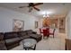 Living room with sectional sofa and view of kitchen at 2888 Bella Vista Dr, Davenport, FL 33897