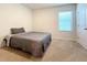 Cozy bedroom with a full-size bed and a large window at 30364 Armenia Rd, Leesburg, FL 34748