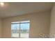 Bright bedroom with large window and neutral walls at 30364 Armenia Rd, Leesburg, FL 34748