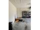 Two-car garage with storage shelving and ample space for parking and storage at 30364 Armenia Rd, Leesburg, FL 34748