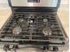 Modern kitchen with a four-burner gas stove at 30364 Armenia Rd, Leesburg, FL 34748