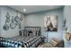 Cozy bedroom with black and white bedding and a gallery wall at 1951 Rosewood Cir, Lakeland, FL 33810