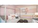 Charming bedroom with pink walls, a four-poster bed, and decorative accents at 1951 Rosewood Cir, Lakeland, FL 33810