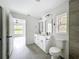 Modern bathroom with a double sink vanity, glass enclosed shower, and matte black hardware at 2449 Jungle St, Lakeland, FL 33801