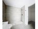 Modern bathroom with a glass-enclosed shower and light gray tiling at 2449 Jungle St, Lakeland, FL 33801