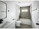 Modern bathroom with a shower-tub combination and matte black hardware at 2449 Jungle St, Lakeland, FL 33801