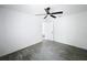 This bedroom features neutral paint, wood look tile, and a ceiling fan at 2449 Jungle St, Lakeland, FL 33801