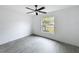 Bright bedroom featuring large window and ceiling fan at 2449 Jungle St, Lakeland, FL 33801