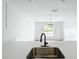 Open kitchen view with modern sink and faucet, connecting to living space at 2449 Jungle St, Lakeland, FL 33801