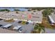 Aerial view of a condo community with a lake in the background at 260 Winter Ridge Blvd # 38, Winter Haven, FL 33881