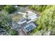 Aerial view of a house with a pool and detached garage at 817 Helen Ave, Deland, FL 32720