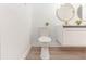 Clean bathroom with white toilet and floating vanity at 817 Helen Ave, Deland, FL 32720