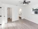 Spacious bedroom with ensuite bathroom access and wood-look floors at 817 Helen Ave, Deland, FL 32720