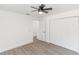 Light bedroom with double doors leading to the closet and hardwood floors at 817 Helen Ave, Deland, FL 32720