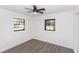 Bright bedroom with two windows and hardwood floors at 817 Helen Ave, Deland, FL 32720