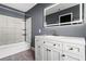 Modern bathroom with white vanity, updated fixtures, and a decorative tile accent wall at 156 Whitman Rd, Winter Haven, FL 33884