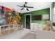 bedroom with dinosaur mural and plenty of storage at 156 Whitman Rd, Winter Haven, FL 33884