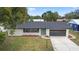 Charming single-story home with newly painted exterior and landscaping at 156 Whitman Rd, Winter Haven, FL 33884