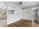 Clean hallway with built-in shelving and hardwood floors at 156 Whitman Rd, Winter Haven, FL 33884