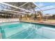 Inviting swimming pool with a screened enclosure at 156 Whitman Rd, Winter Haven, FL 33884