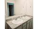 Double vanity bathroom with granite countertop at 163 Tiny Flower Rd, Davenport, FL 33837