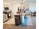 Modern kitchen with granite island and stainless steel appliances at 163 Tiny Flower Rd, Davenport, FL 33837