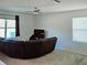 Living room with sectional sofa and large window at 163 Tiny Flower Rd, Davenport, FL 33837