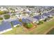 Aerial view showcasing a house with a backyard and solar panels at 3782 Hampton Hills Dr, Lakeland, FL 33810