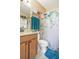 Clean bathroom with a shower/tub combo and wood vanity at 3782 Hampton Hills Dr, Lakeland, FL 33810