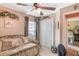 Bedroom with daybed, ceiling fan, and access to another bedroom at 3782 Hampton Hills Dr, Lakeland, FL 33810