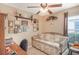 Bedroom with daybed, ceiling fan, and plenty of natural light at 3782 Hampton Hills Dr, Lakeland, FL 33810