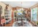 Charming dining area with a round table, decorative rug, and hardwood floors at 3782 Hampton Hills Dr, Lakeland, FL 33810