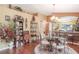 Bright dining room features a glass-top table with ornate chairs and hardwood floors at 3782 Hampton Hills Dr, Lakeland, FL 33810