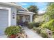 Welcoming front entrance with a dark door, porch, and lush landscaping at 3782 Hampton Hills Dr, Lakeland, FL 33810