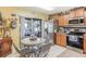 Kitchen boasts stainless steel appliances and light wood cabinets at 3782 Hampton Hills Dr, Lakeland, FL 33810