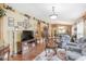 Bright living room featuring hardwood floors, comfortable seating, and an open floor plan at 3782 Hampton Hills Dr, Lakeland, FL 33810