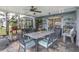 Relaxing screened porch with outdoor furniture and ceiling fan at 3782 Hampton Hills Dr, Lakeland, FL 33810