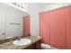 Bathroom with vanity, sink, and coral shower curtain at 1066 Krenson Woods Rd, Lakeland, FL 33813