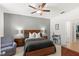 Comfortable bedroom with ceiling fan and wood furniture at 1066 Krenson Woods Rd, Lakeland, FL 33813