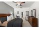 Spacious bedroom with wood furniture and ceiling fan at 1066 Krenson Woods Rd, Lakeland, FL 33813