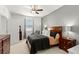 Bright bedroom with wood furniture and ceiling fan at 1066 Krenson Woods Rd, Lakeland, FL 33813