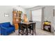 Dining area with wooden hutch, table, and four black chairs at 1066 Krenson Woods Rd, Lakeland, FL 33813