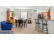 Dining area with wooden hutch, table, and four black chairs at 1066 Krenson Woods Rd, Lakeland, FL 33813