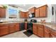 Modern kitchen with granite countertops and stainless steel appliances at 1066 Krenson Woods Rd, Lakeland, FL 33813