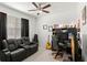 Home office with black leather couch and gaming setup at 1066 Krenson Woods Rd, Lakeland, FL 33813