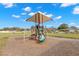 Community playground with shaded play structure at 1066 Krenson Woods Rd, Lakeland, FL 33813