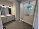 Modern bathroom with dual sink vanity, tiled shower, and stylish fixtures at 1701 Ferris Ave, Orlando, FL 32803