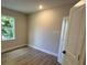 Bedroom features stylish floors and a window to let the sun shine in at 1701 Ferris Ave, Orlando, FL 32803