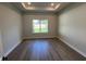 Spacious bedroom featuring modern hardwood floors and a bright window view at 1701 Ferris Ave, Orlando, FL 32803